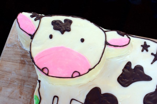 Homemade cow cake with chocolate writing