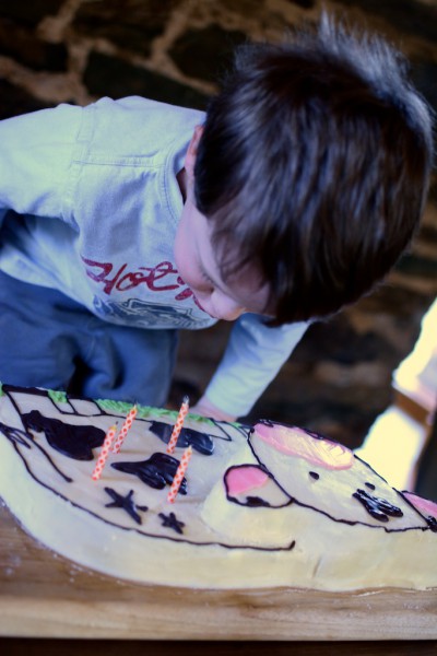 Homemade cow cake with chocolate writing